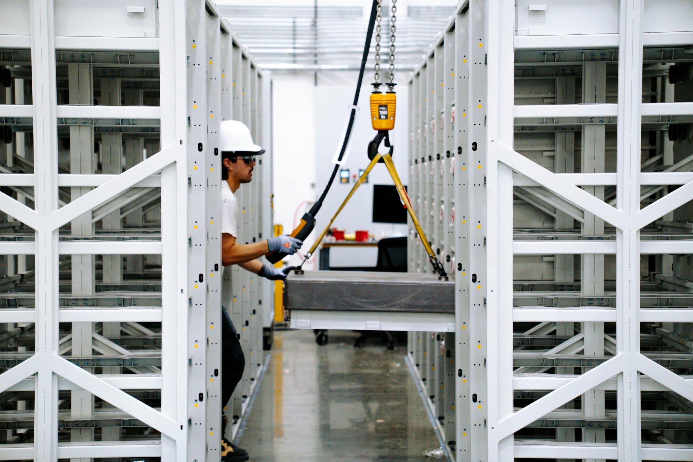 Zach assembling battery rack on the bench rig at Arc HQ, in Torrance, California.