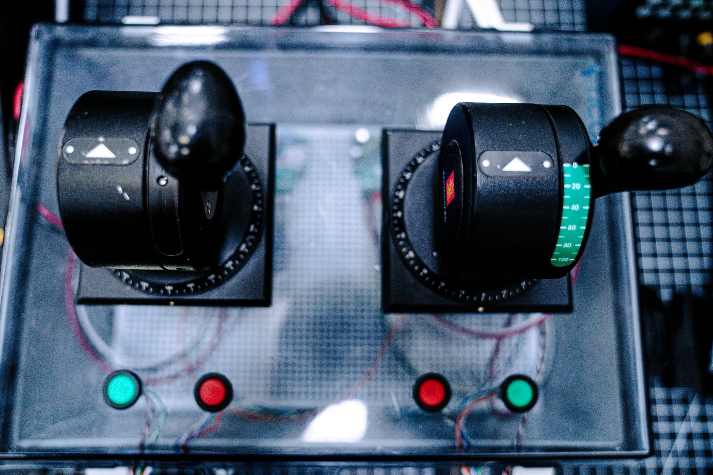 Dual helm joystick controls on the bench rig.