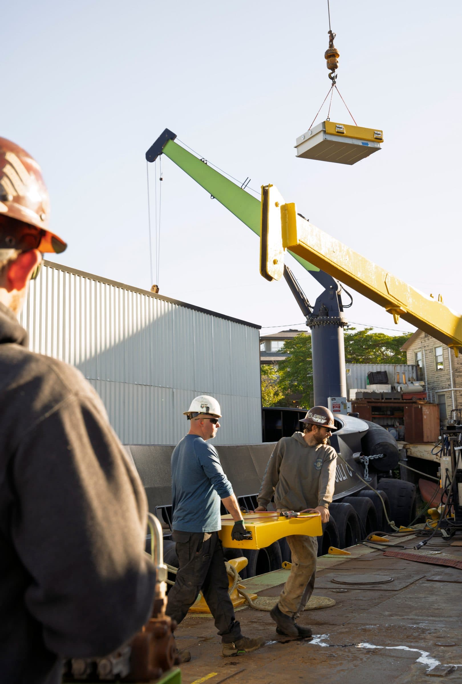 Crane hoisting a battery module into Tuuli C’s battery room.