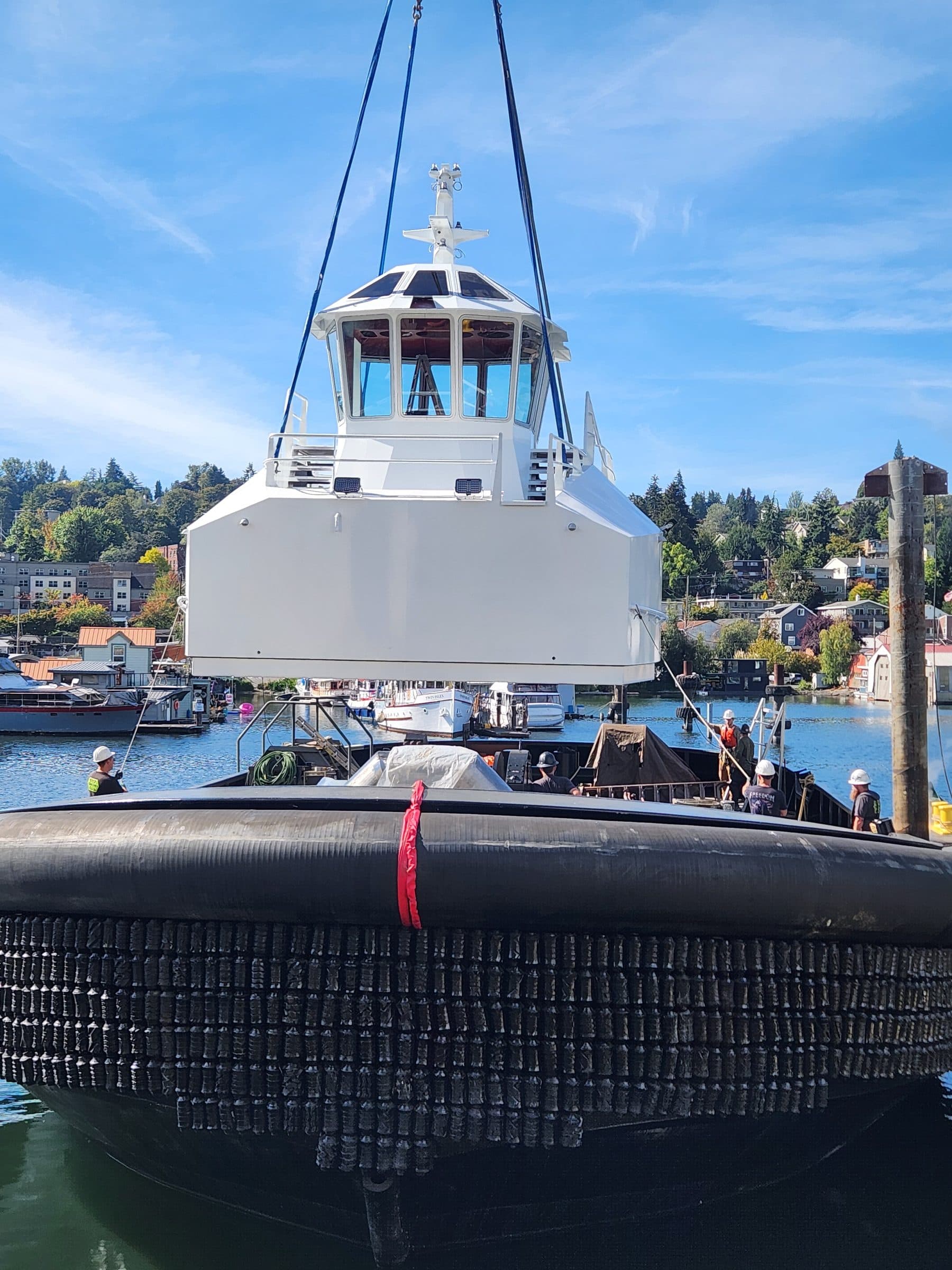 Hoisting painted deck housing onto Tuuli C.