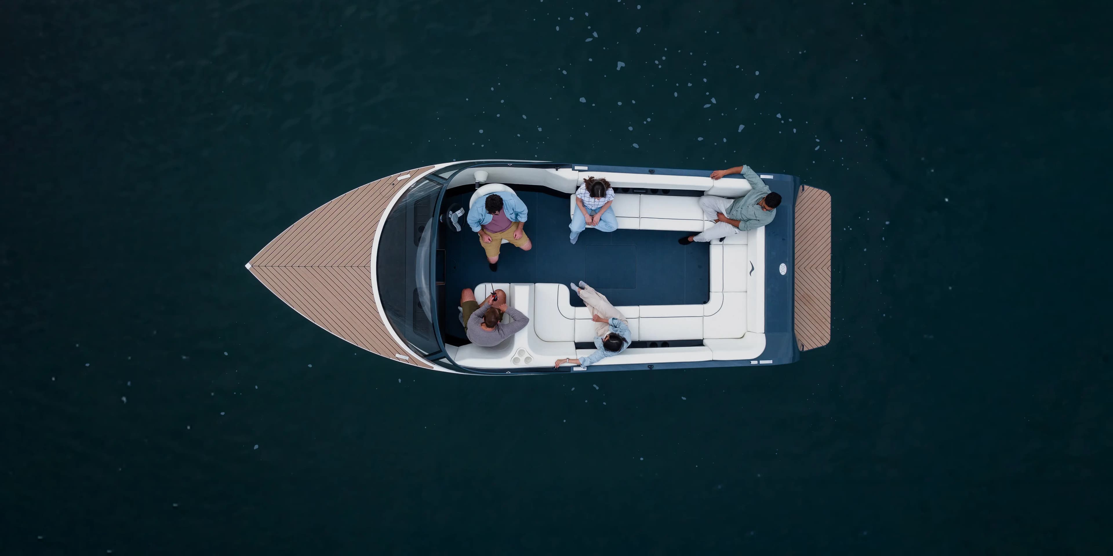 A photograph of an EV boat zipping through the water