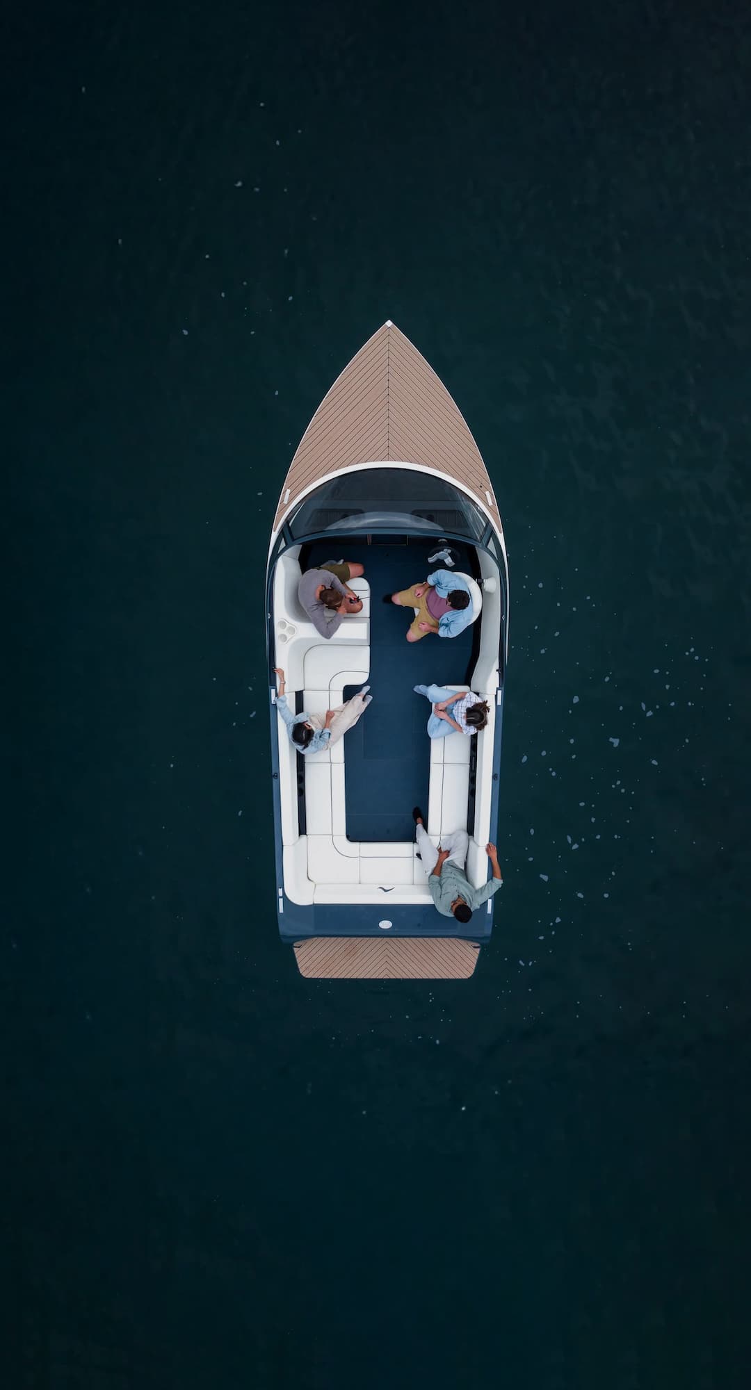 A photograph of an EV boat zipping through the water