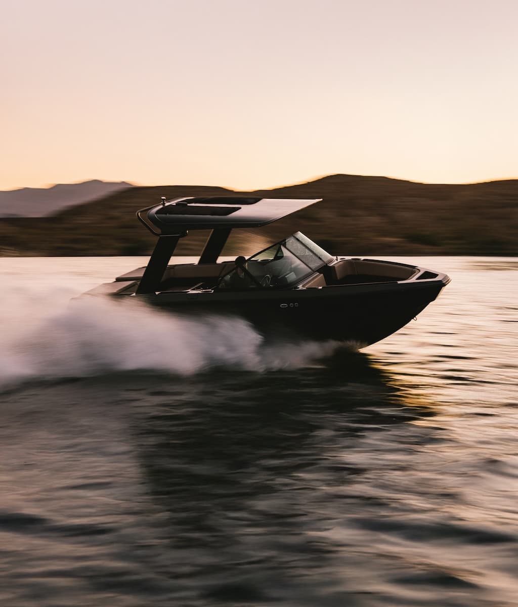 A photograph of an EV boat zipping through the water