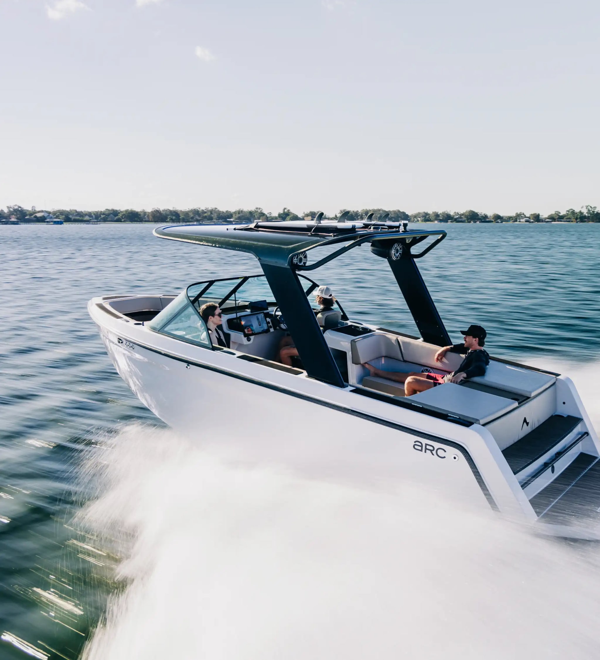 A photograph of an EV boat zipping through the water.