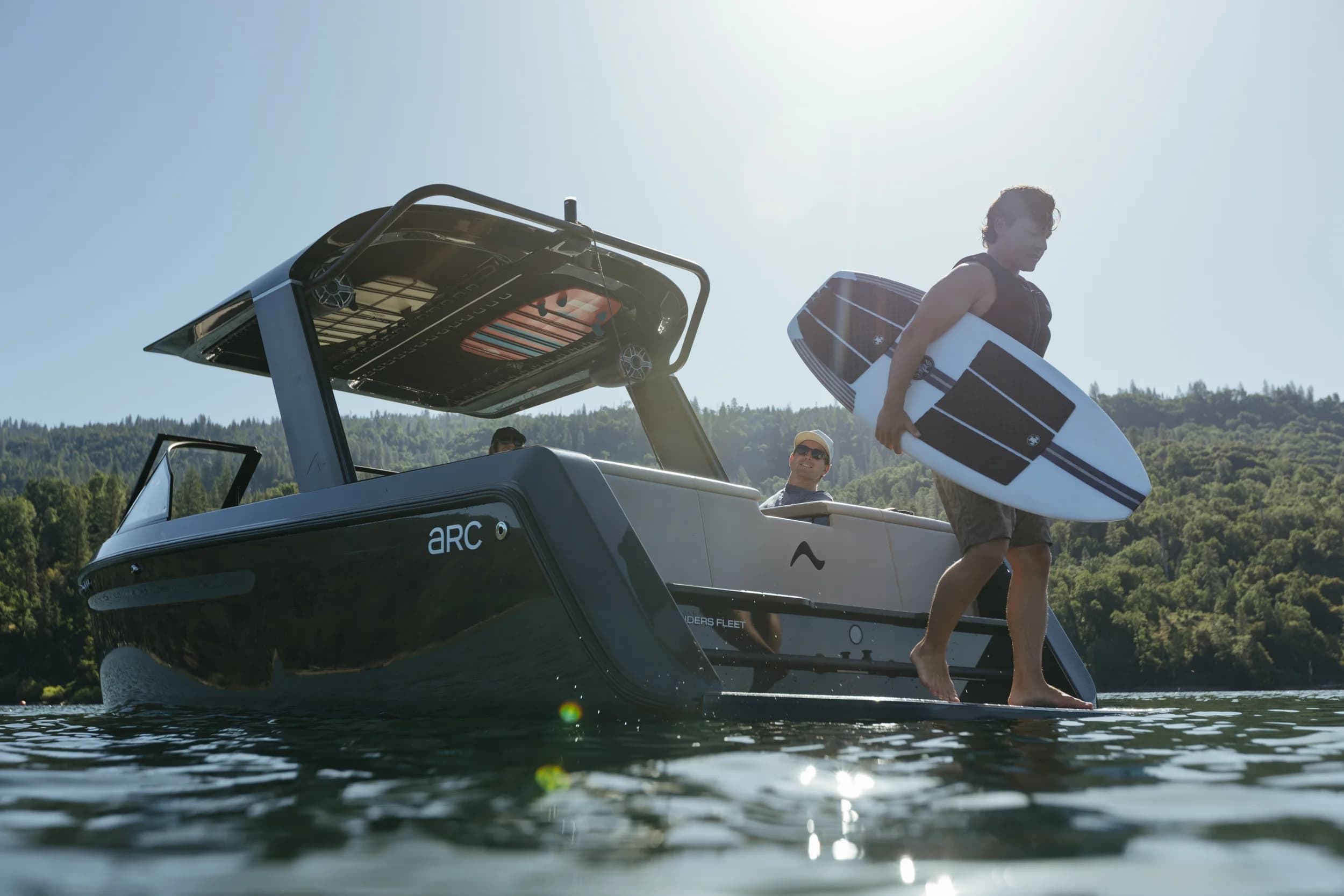 A photograph of an EV boat zipping through the water