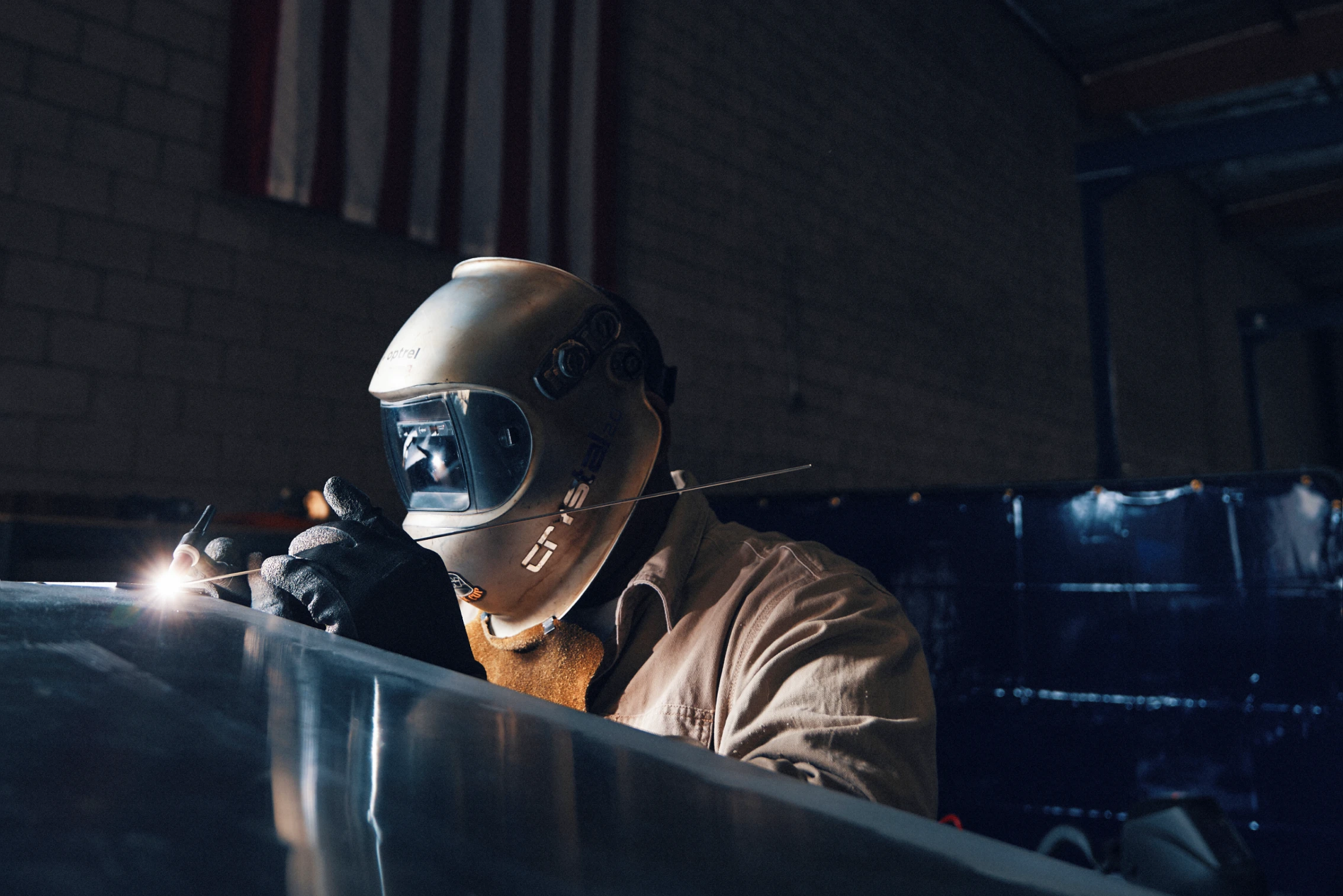 A welder at work in the Arc Boats factory