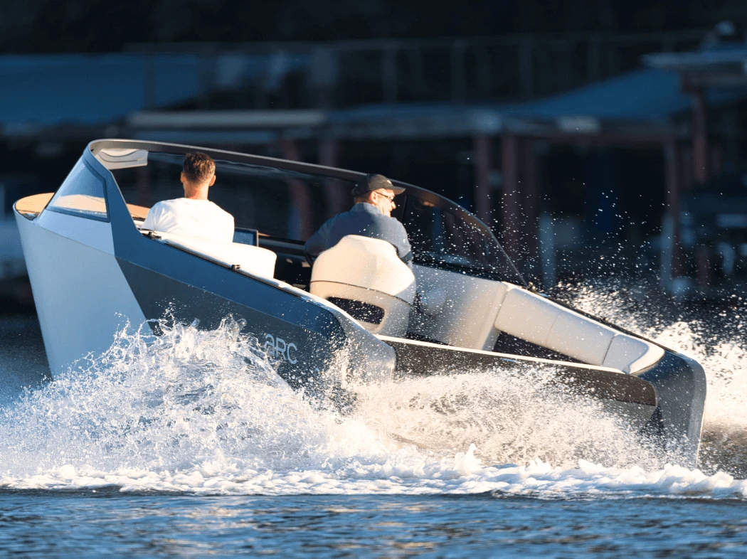 A rear view of the Arc One creating wake on Austin Lake